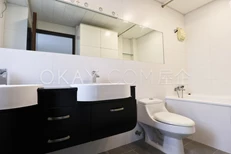 Master bathroom with double vanity and tub