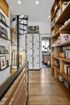 Double-depth bookshelves on 1st floor